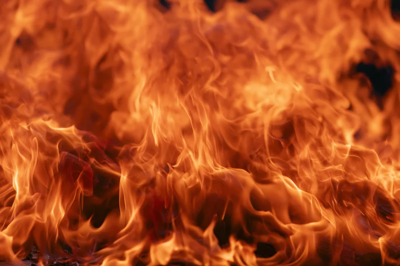 Intense flames filling the frame with swirling orange and red fire