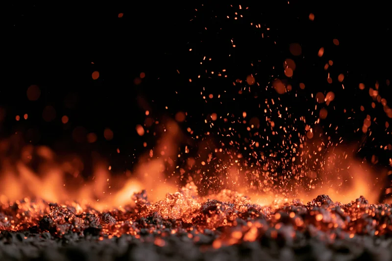 Fire flames and glowing embers burning along the bottom edge