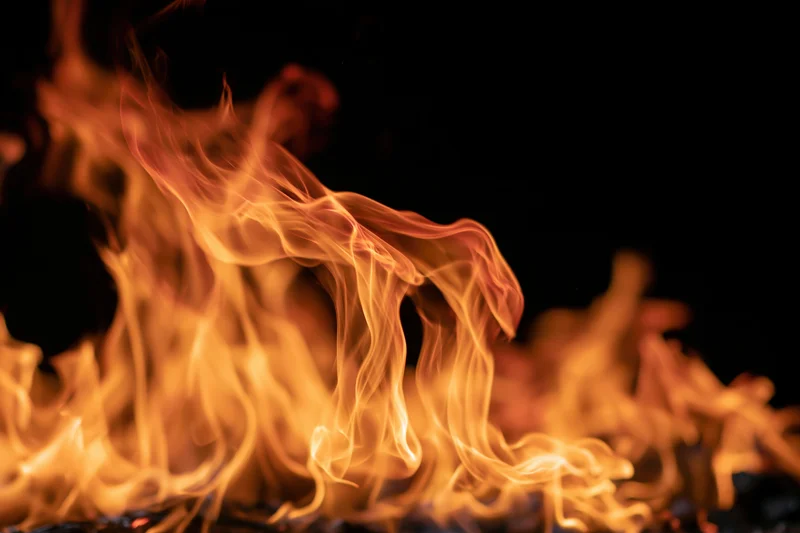 Intense flames burning against a black background