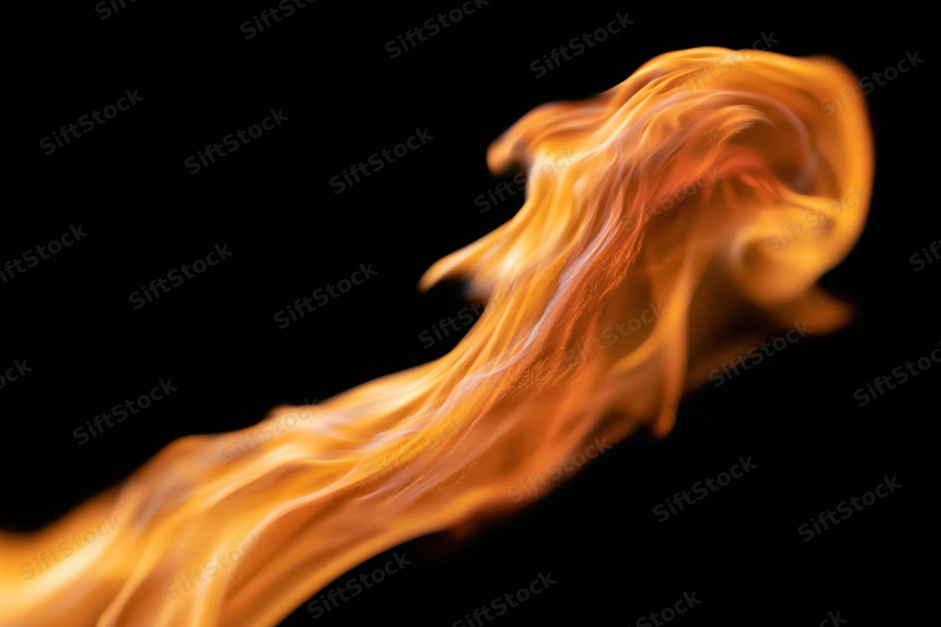 Dynamic flame burst in motion against black background