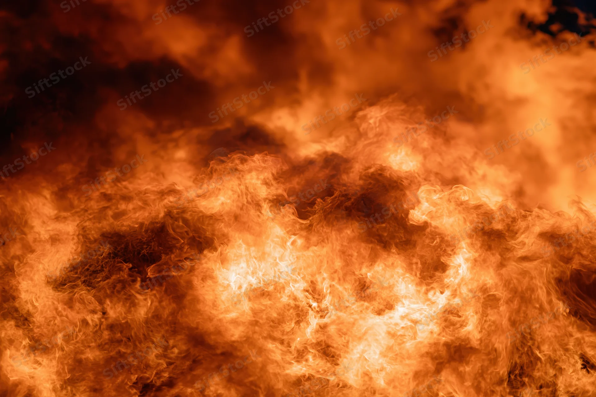 Intense flames burning at night in extreme closeup