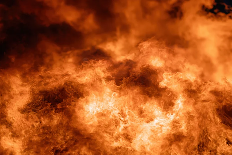 Intense flames burning at night in extreme closeup