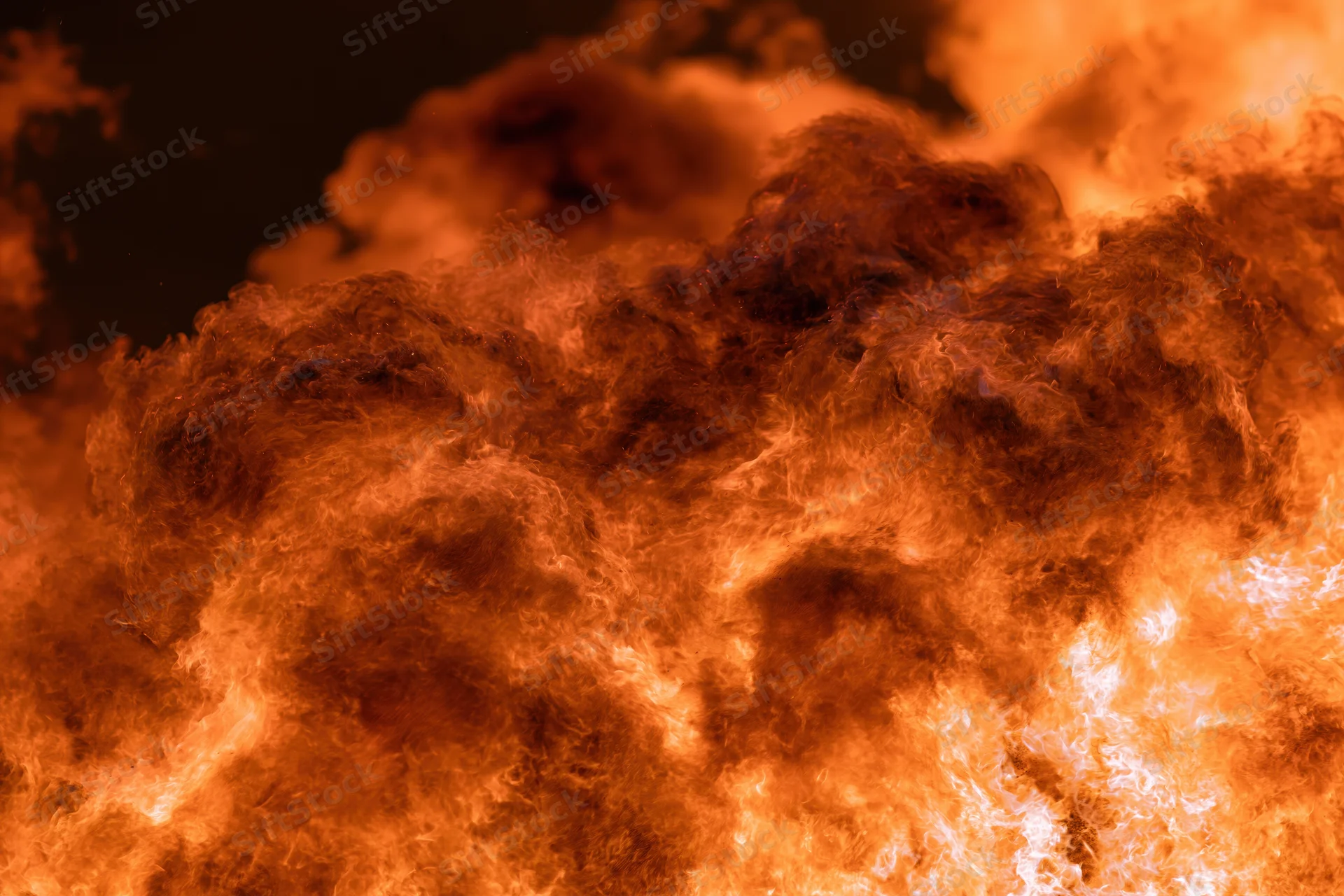 Intense flames burning at night in extreme closeup