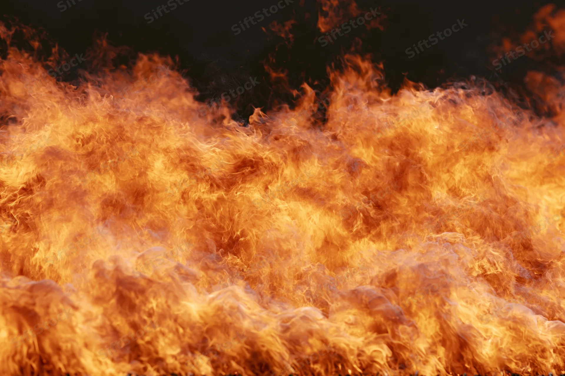Large wall of open flames filling the frame shot close