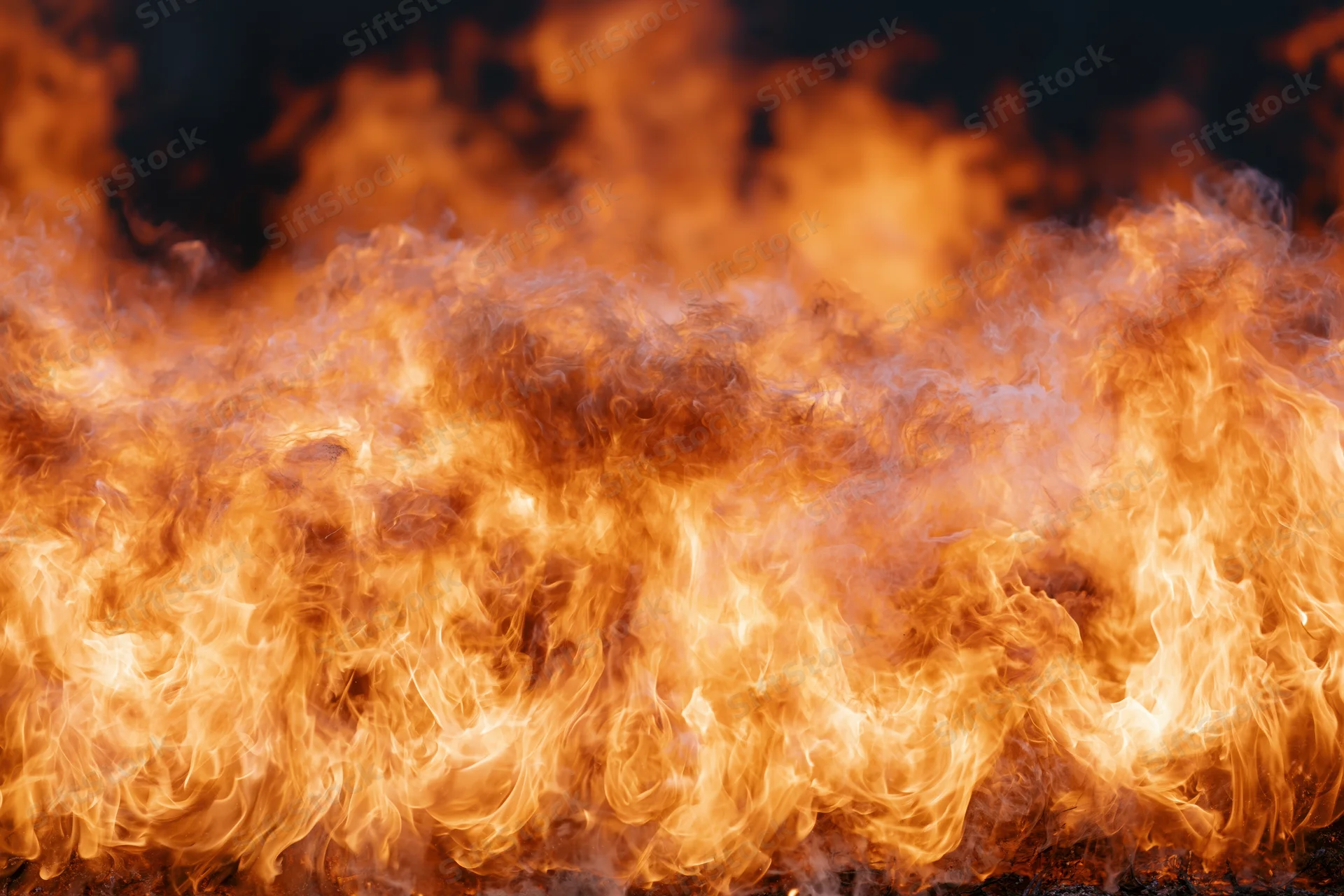 Large wall of open flames filling the frame shot close