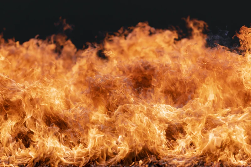 Large wall of open flames filling the frame shot close