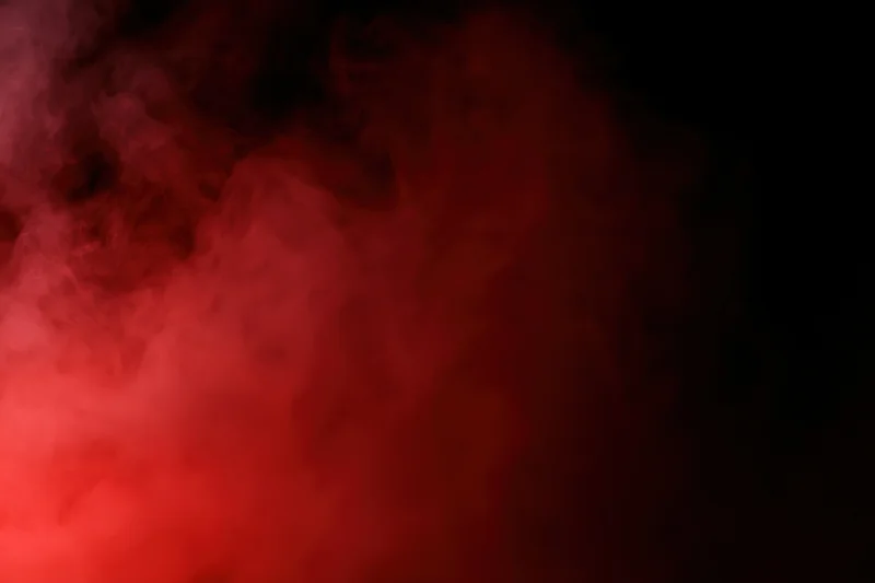 Swirling red smoke against a dark background