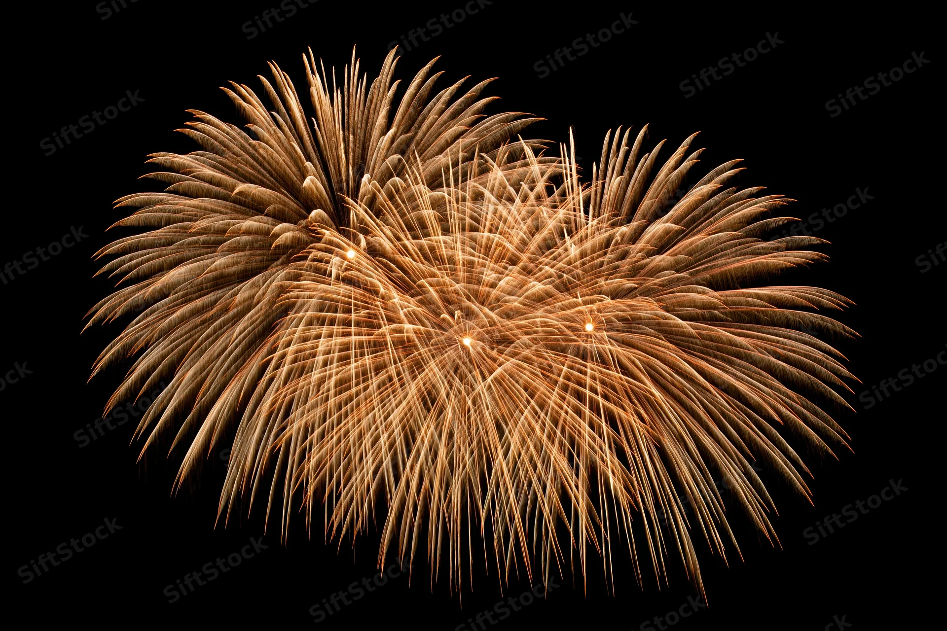 Golden fireworks bursting simultaneously in the night sky