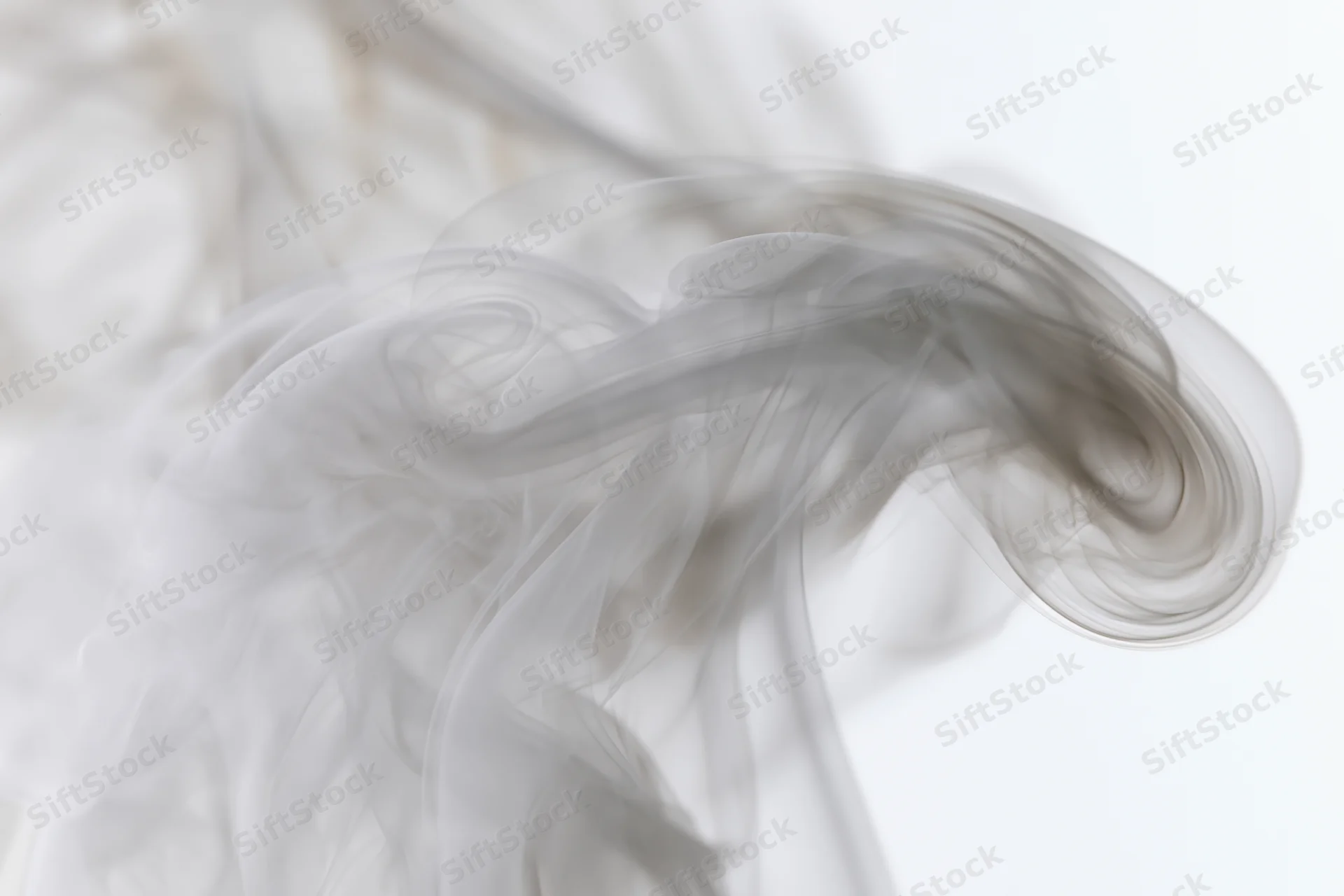 Wispy smoke curling upward against a plain white background