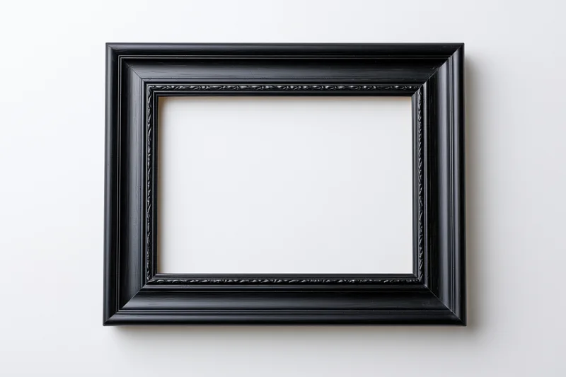 Black rectangular picture frame with molded edges hanging on white wall