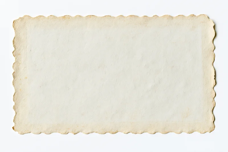 Blank vintage photograph print with scalloped edges on white background