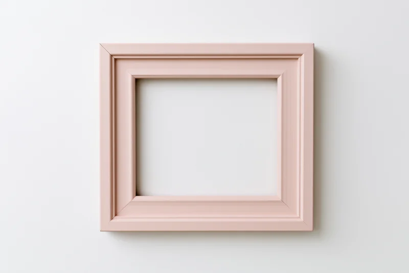 Pale pink wooden picture frame with simple molded edges hanging on a white wall