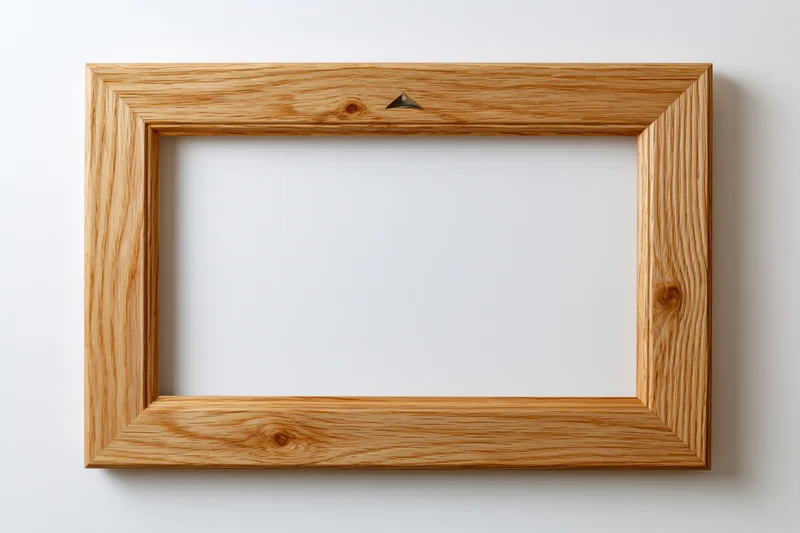 Wooden picture frame hanging on a white wall with empty center for display