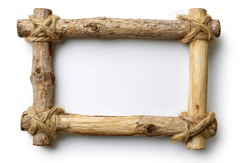 Rustic wooden frame made from branches tied with twine on white background