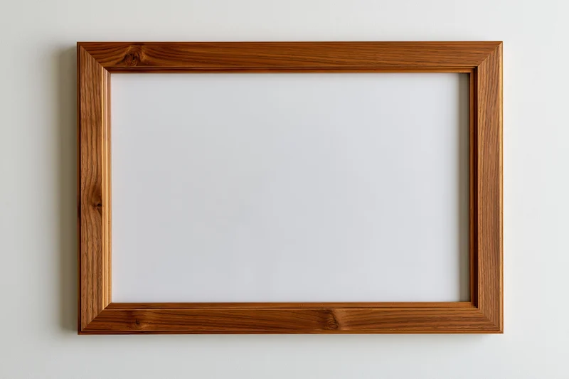 Wooden picture frame hanging on white wall with empty white center