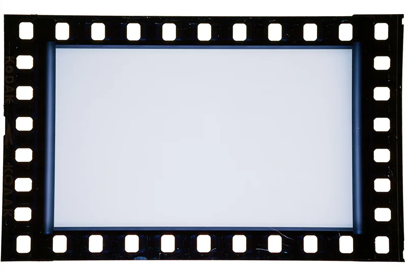Single 35mm film frame with sprocket holes on white background