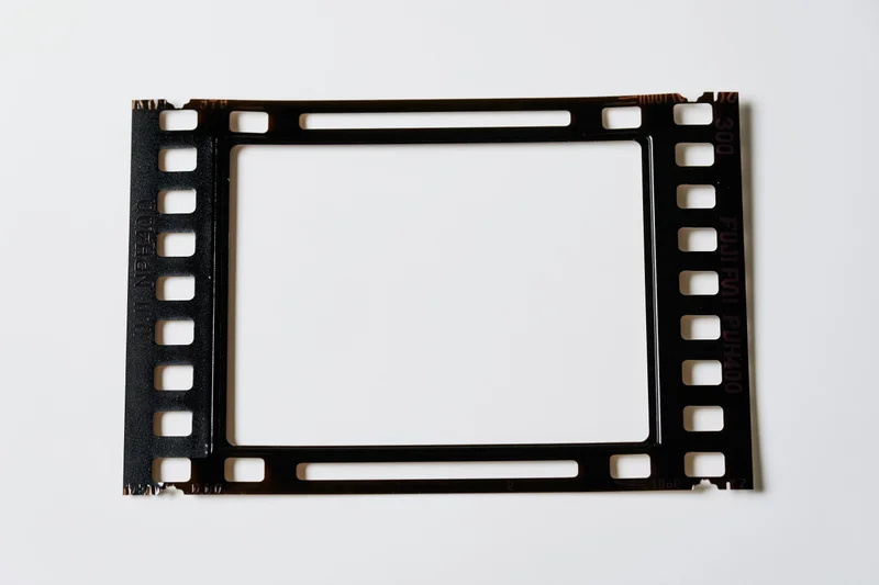 Blank 35mm film frame with black border and white center on white background