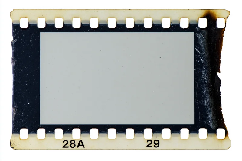 Blank 35mm film strip frame with sprocket holes and burnt edges isolated on white