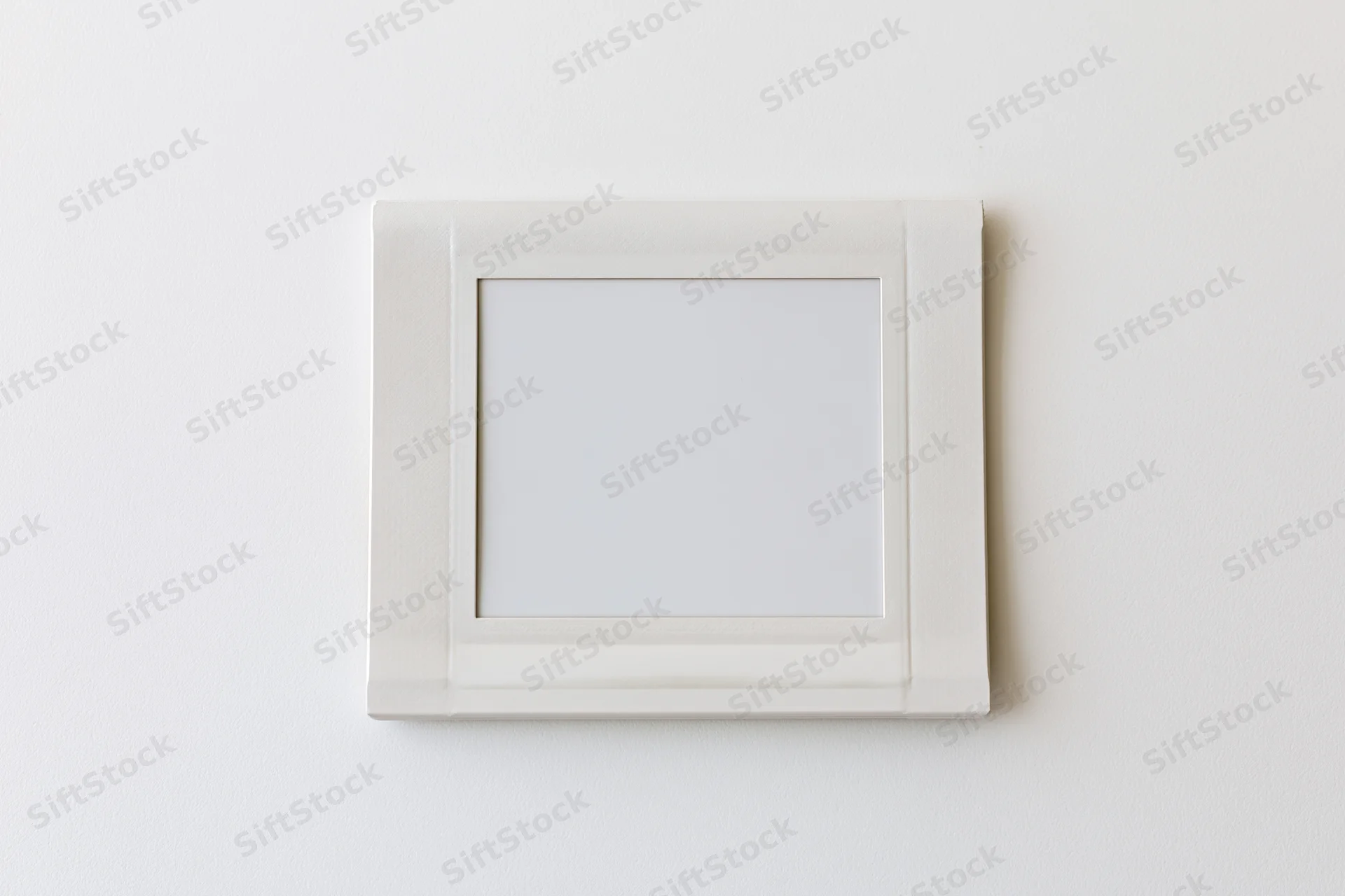 Blank instant photo print lying flat on a white surface