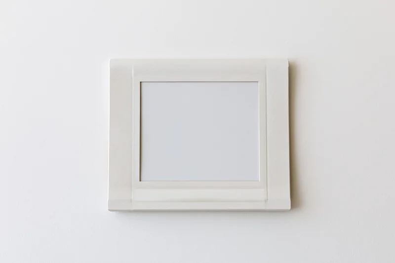 Blank instant photo print lying flat on a white surface