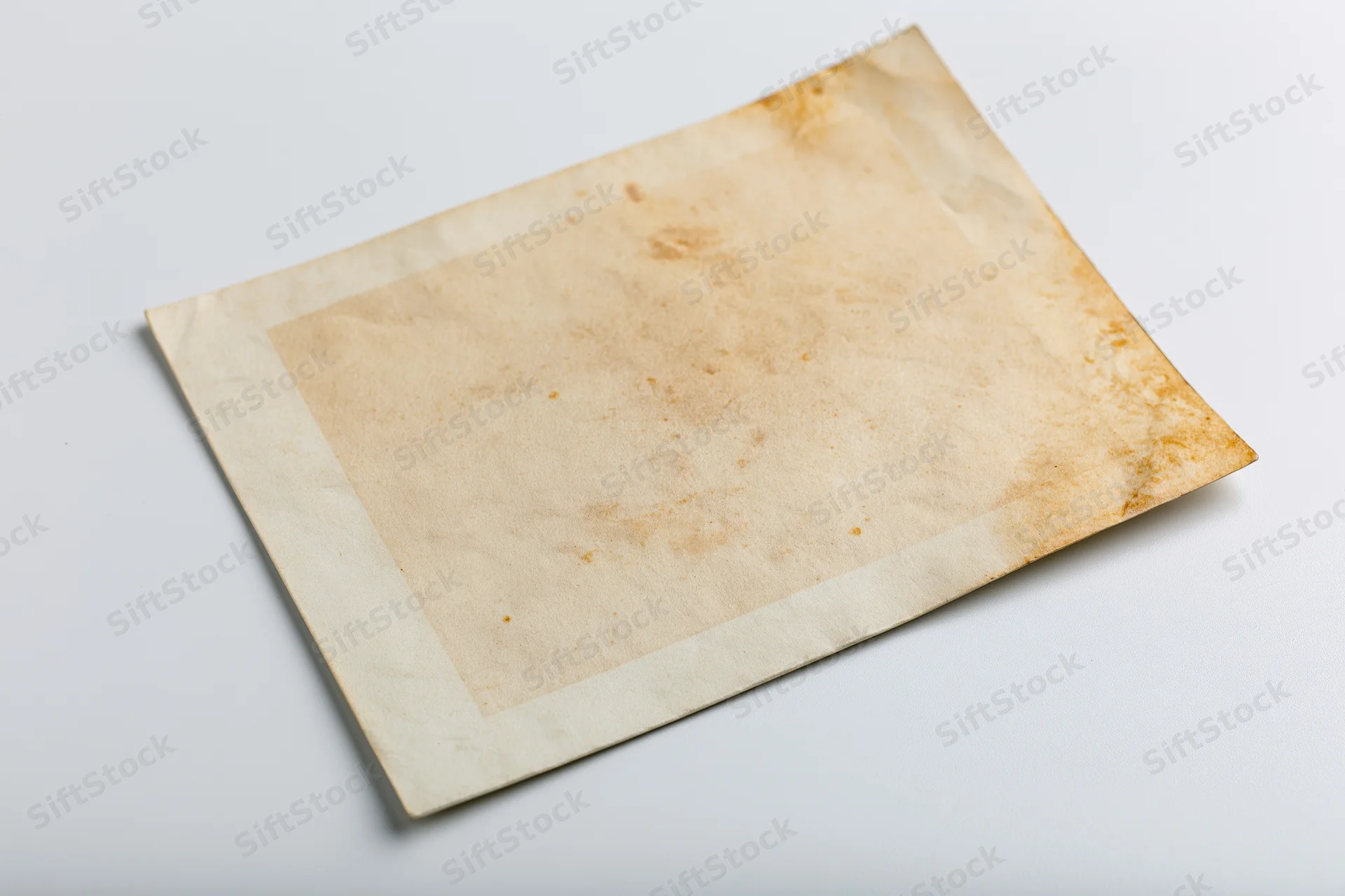 Vintage photo print border lying flat on white surface