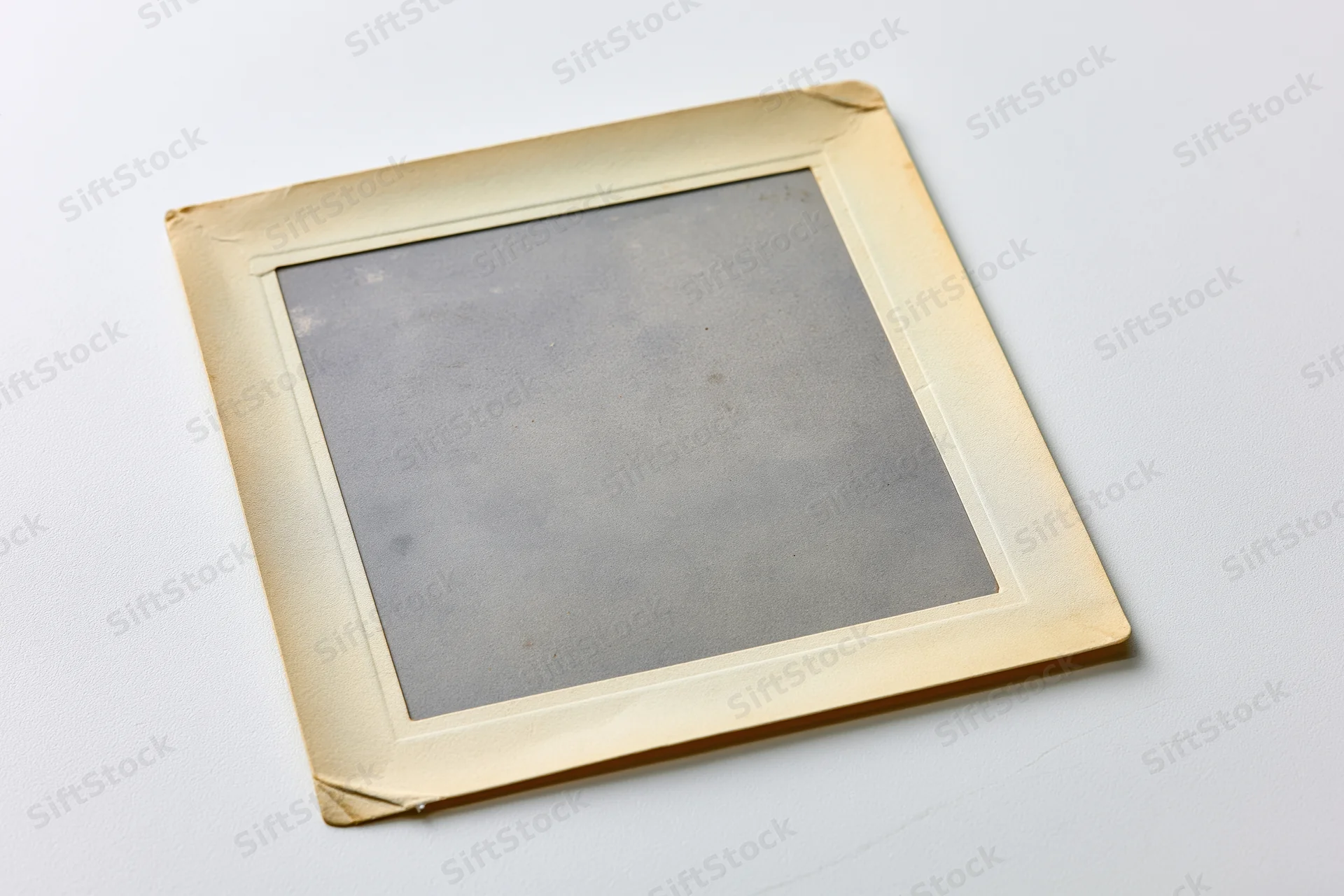 Vintage photograph print lying flat on white surface