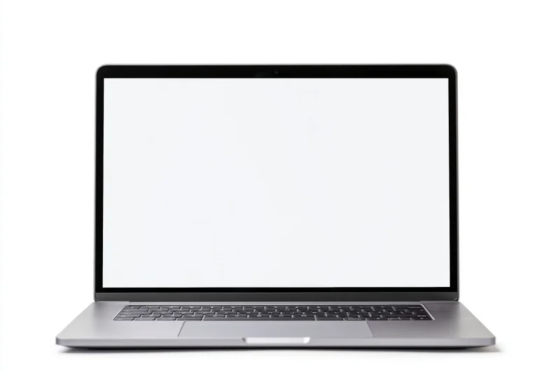 Slim silver laptop with blank white screen open on white background