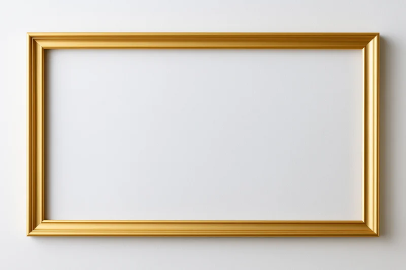 Gold picture frame mounted on white wall with empty center for display