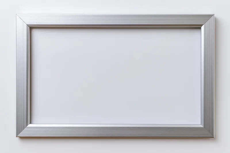 Silver brushed metallic picture frame with white mat on white wall