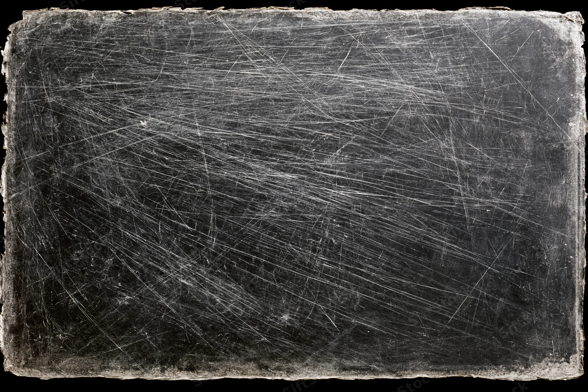 Heavily scratched and worn darkroom photographic paper with frayed edges