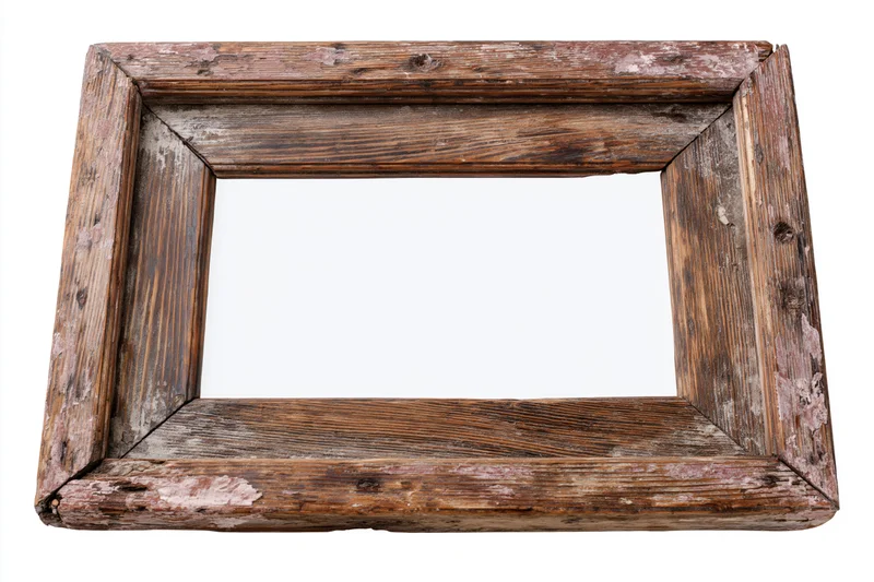 Aged wooden picture frame with chipped paint and worn edges isolated on white background