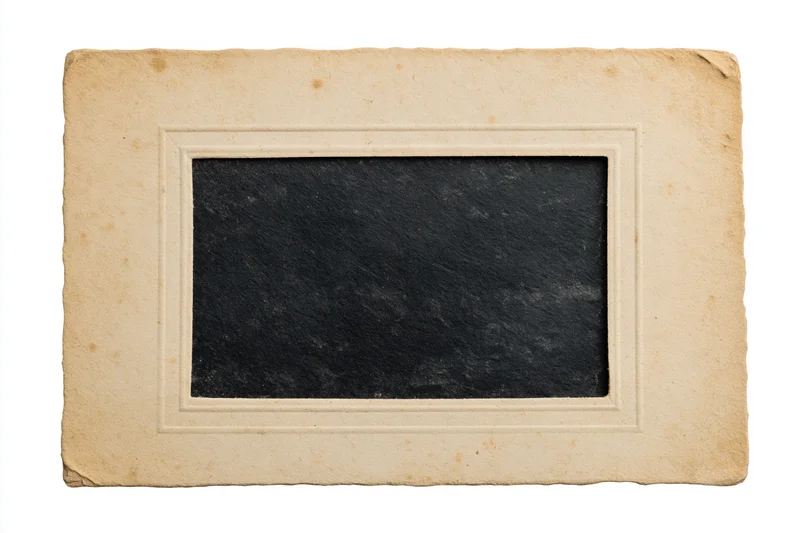 Vintage blank photographic print with beige paper border lying flat on white background