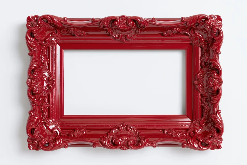 Ornate red baroque-style picture frame with glossy finish on white background