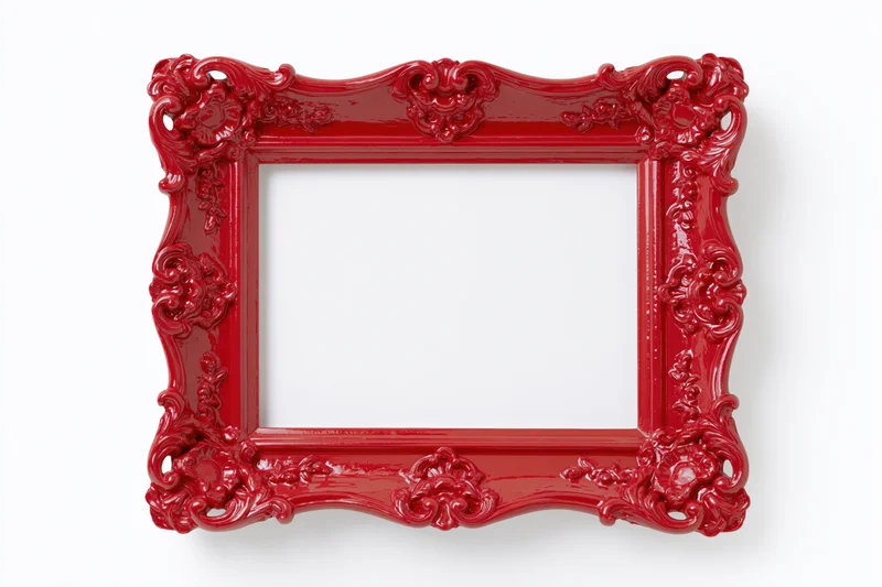 Ornate red baroque-style picture frame with glossy finish and intricate carvings isolated on white background