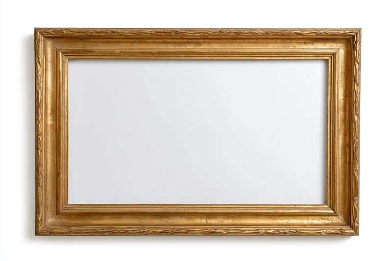 Ornate gold picture frame with carved details on white background
