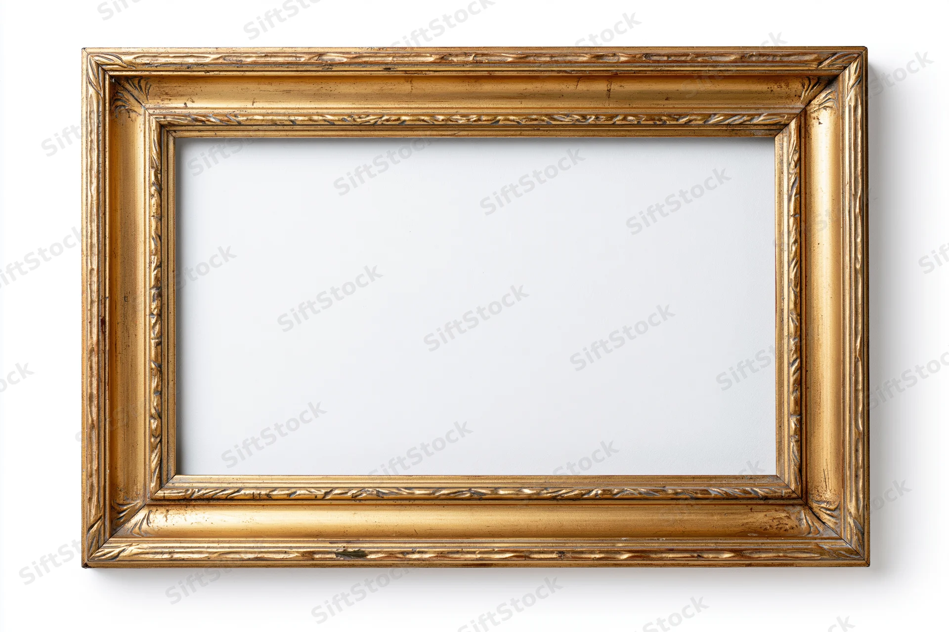 Ornate gold picture frame with carved details on white background