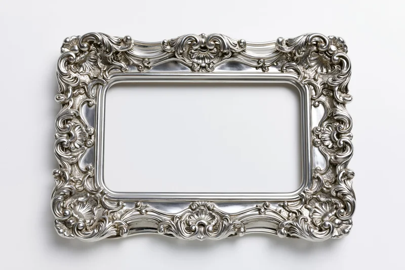 Ornate silver baroque frame with intricate scrollwork on white background