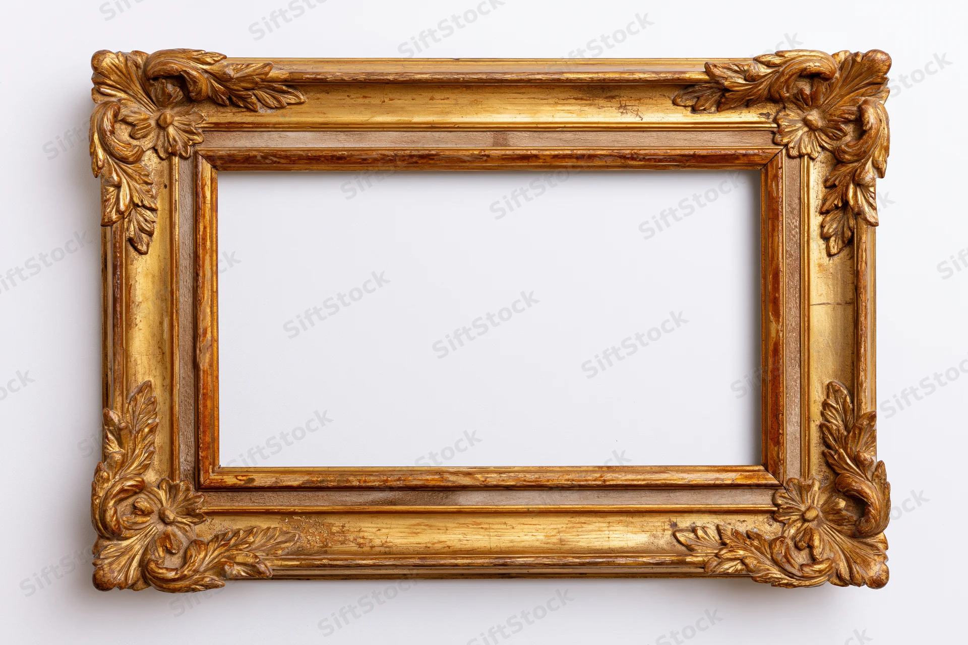 Ornate gilded wooden frame with carved floral details on white background