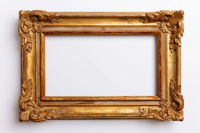 Ornate gilded wooden frame with carved floral details on white background
