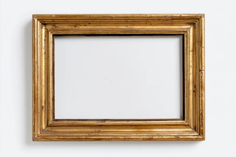 Antique gold picture frame with empty white interior on plain white background