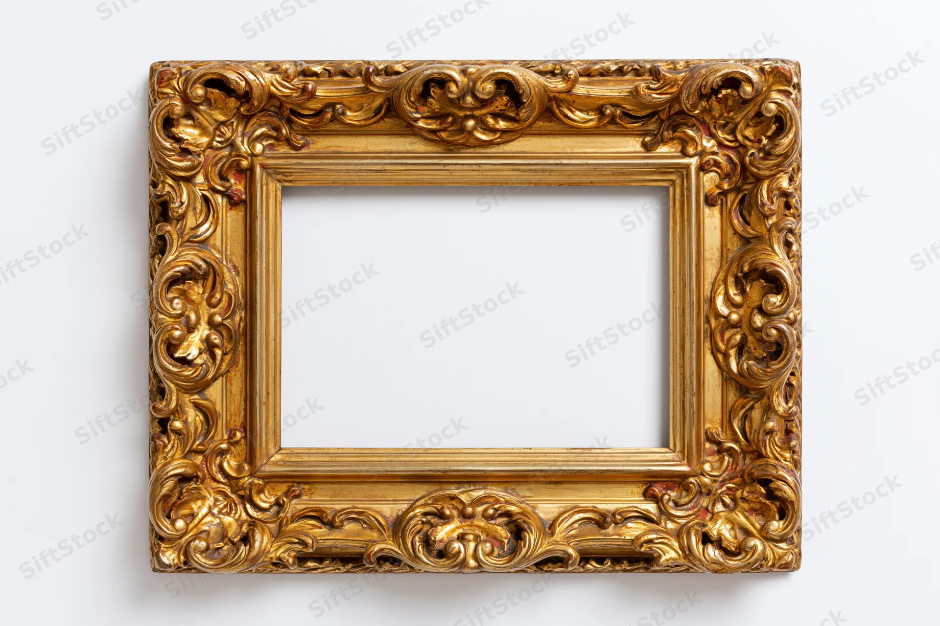 Ornate gold antique frame with intricate carved floral details on white background