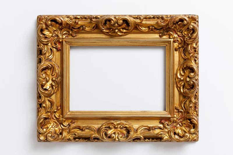 Ornate gold antique frame with intricate carved floral details on white background