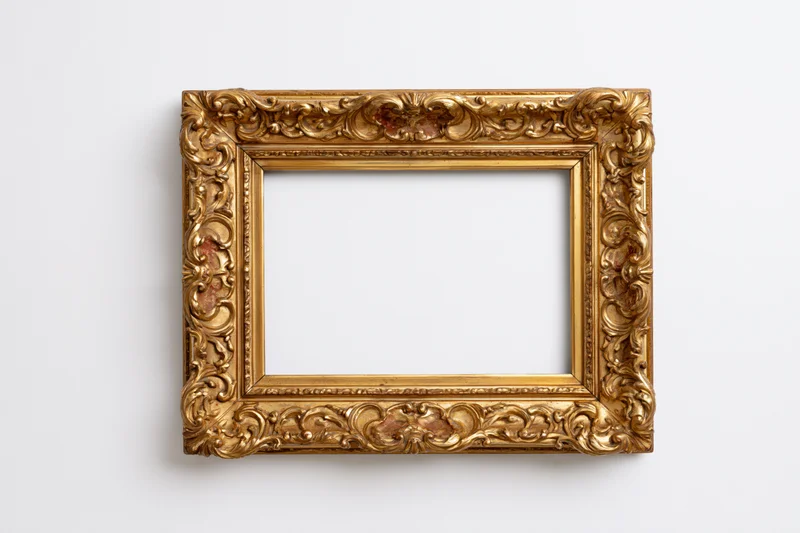 Ornate gold antique frame with carved floral details on white background