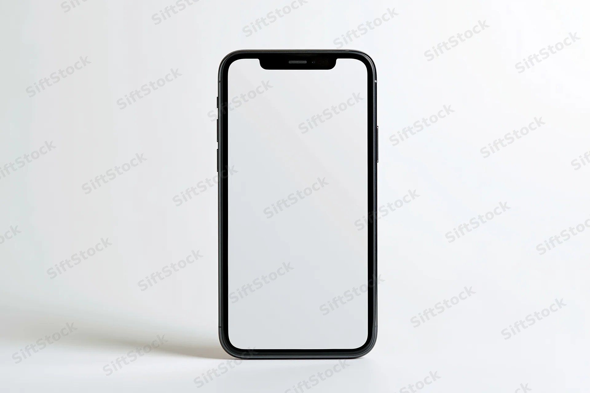 Black smartphone with blank white screen standing upright on white surface