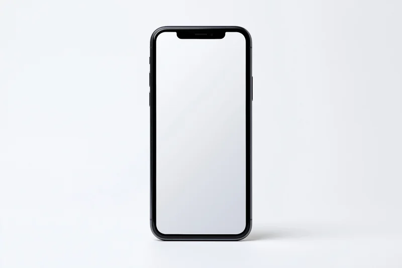 Black smartphone with blank white screen standing upright on white background