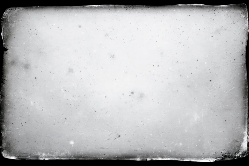 Aged film frame texture with distressed edges and speckled surface