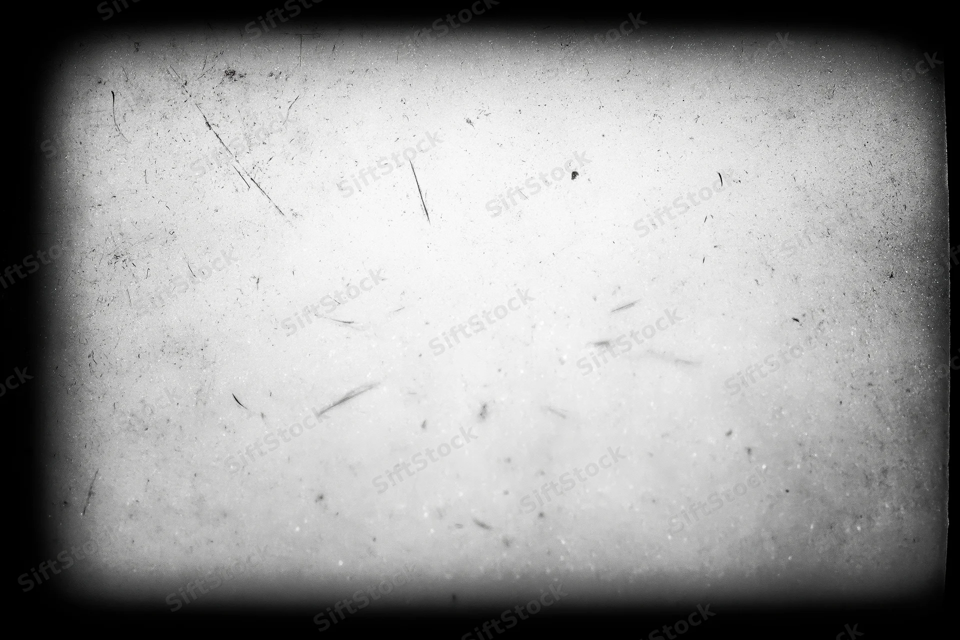 Overexposed vintage film frame with scratches and dust, showing aged texture and vignette border