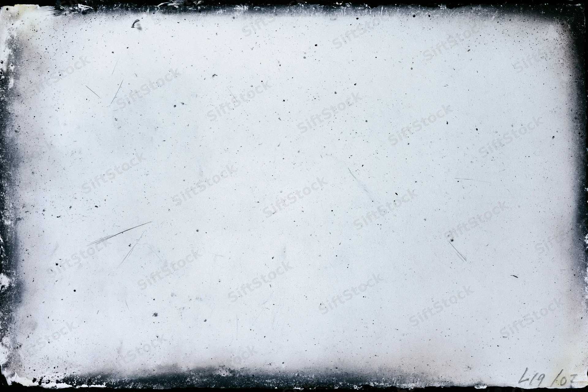 Aged photographic paper with darkroom border burn and speckled texture