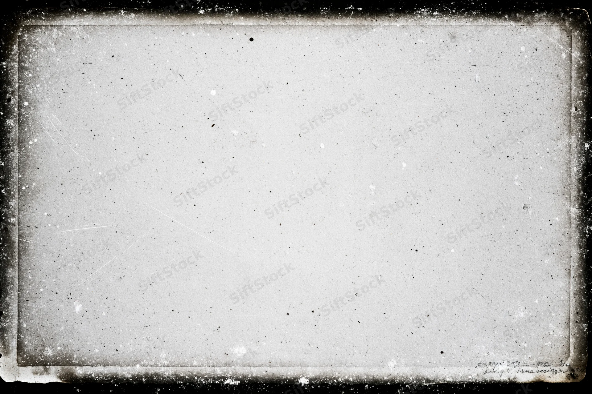 Aged photographic paper with darkroom border burn and textured surface