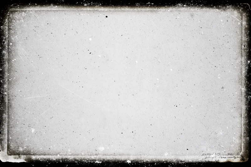 Aged photographic paper with darkroom border burn and textured surface